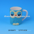 Taza de cerámica de encargo al por mayor directa del buho de la fábrica con la manija